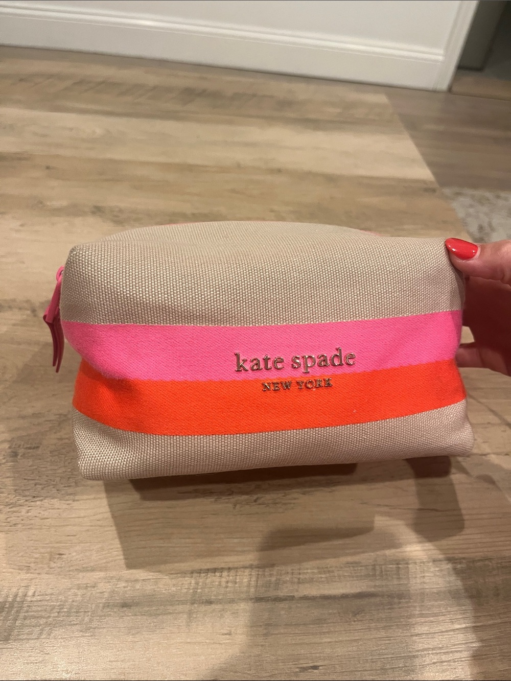 Kate Spade beige cosmetic/travel Pouch with Pink & Orange Stripes